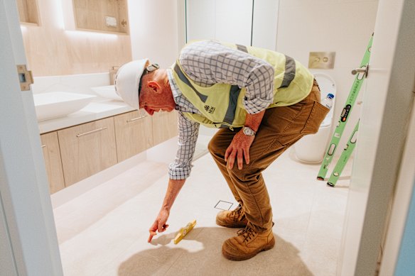 Building Commissioner James Sherrard inspects a property at Willoughby.
