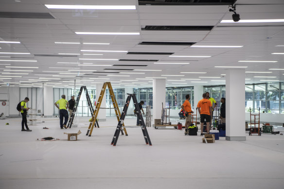 Workers at the mass-vaccination centre at Sydney Olympic Park on Thursday.