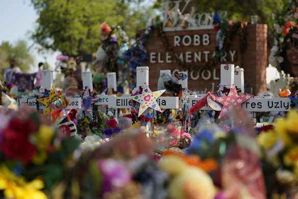 Crosses, flowers and other memorabilia form a makeshift memorial for the victims of the shootings at Robb Elementary school in Uvalde, Texas.