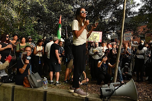 Hannah Thomas addresses the crowd in Harmony Park next to the Surry Hills Police Station.
