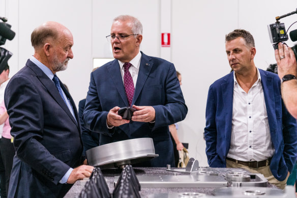 Prime Minister Scott Morrison speaks to Air Affairs Australia chief executive Chris Sievers about the trainees he has hired.