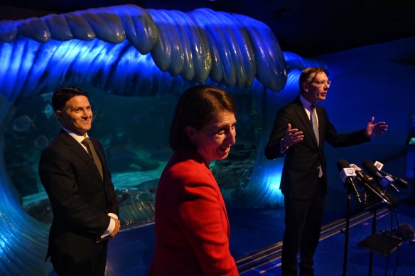 Premier Gladys Berejiklian, Treasurer Dominic Perrottet and Customer Service Minister Victor Dominello at the Sea Life Sydney Aquarium on Friday.