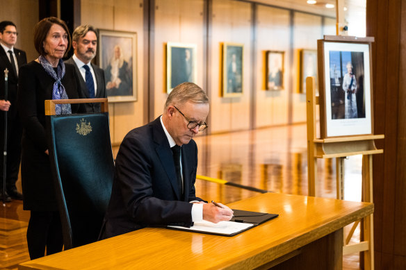 Australian Prime Minister Anthony Albanese signs the Queen’s book of condolences at Parliament House, Canberra.