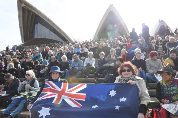 Margaret Cheah, left, and Judy Scott with their flag at the Opera House for Bob Hawke's memorial service.
