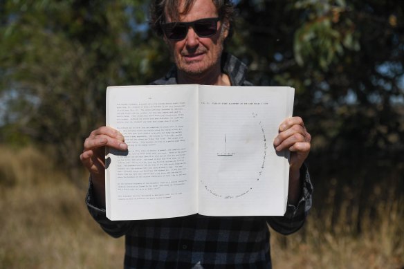 Neil Murray holds a document displaying the Aboriginal stone arrangement near Lake Bolac. 
