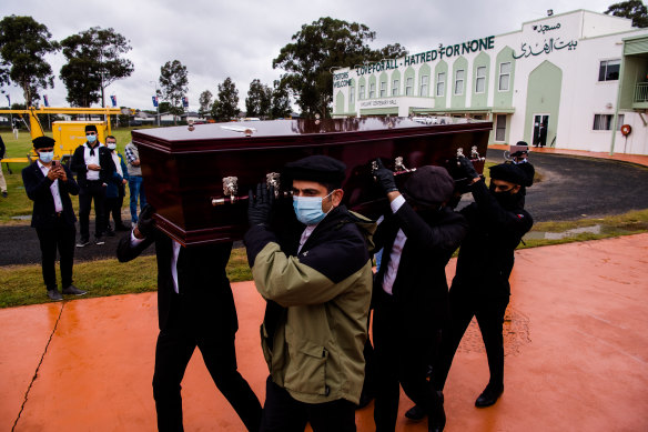 Pallbearers carry Ayaz Younus’s coffin at his funeral.