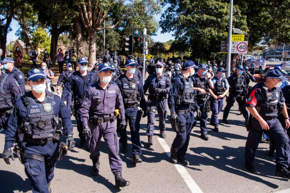 Police swarm Broadway near Sydney’s CBD to arrest anti-lockdown protesters at a rally in August.