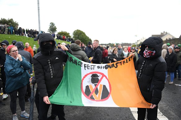Protesters held banners as they gathered on Garvaghy Road.