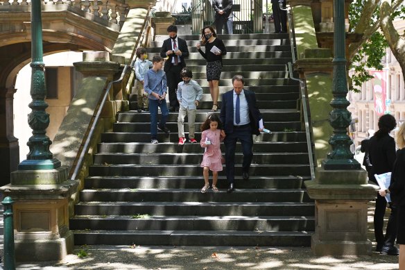 Family including grandchildren and great-grandchildren leaving the memorial.