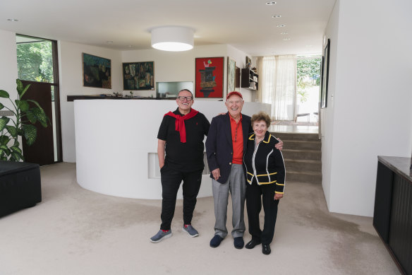 Henry Weinreich with his parents Joseph and Aneta Weinreich inside their Seidler-designed home.