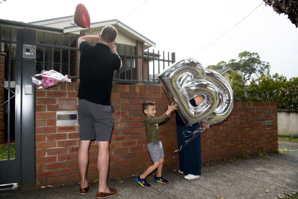 People arrive at Gladys Berejiklian’s house with balloons in her initials.