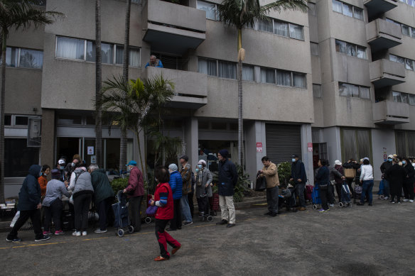 Residents queuing for food during the coronavirus pandemic at Waterloo's public housing estate.