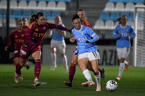 Heatley (left) in action for AS Roma in the Italian capital last month.