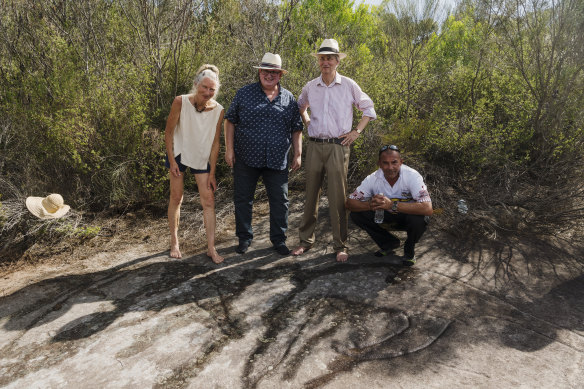 The Cromer Heights rock carvings were declared protected on Thursday. From left: Conny Harris, Aboriginal Affairs Minister Don Harwin, Anthony Harris and land council CEO Nathan Moran. 