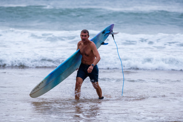 Rob Stokes emerges from the surf on the northern beaches.