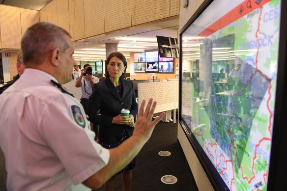 NSW Premier Gladys Berejiklian receiving a briefing on Monday morning.