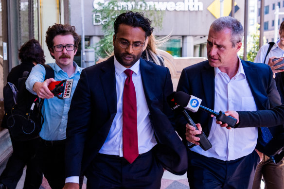 Defence barrister Sam Pararajasingham (centre) leaves court on Wednesday.