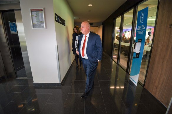 Victorian Treasurer Tim Pallas walks into the budget lockup on Thursday.