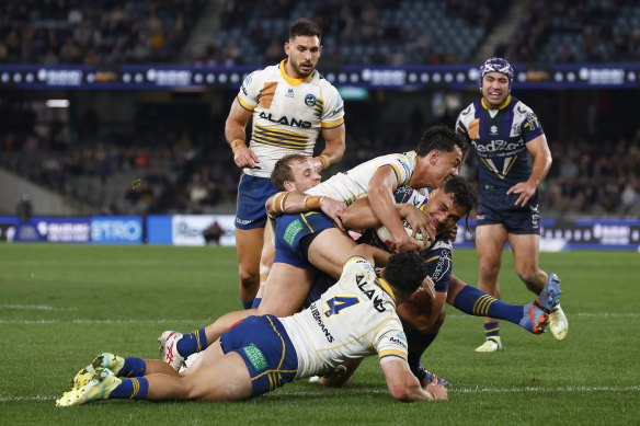 Eliesa Katoa scores a try despite getting plenty of attention  from Eels defenders.