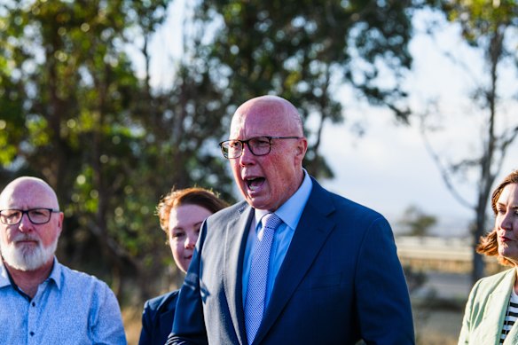 Peter Dutton in Gorton on Monday with candidate John Fletcher (left).