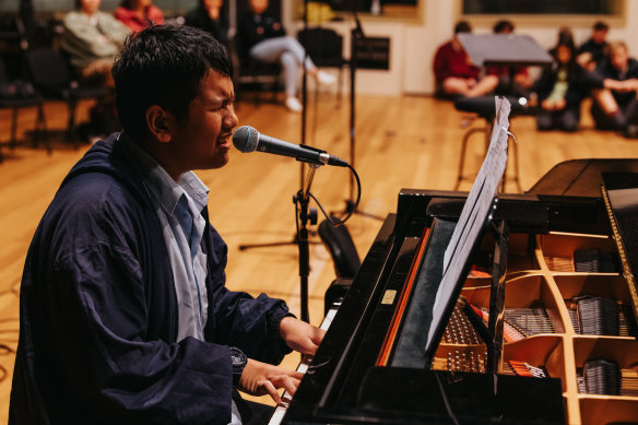 Omar Laksono from Mascot’s JJ Cahill Memorial High School performs for the other students.