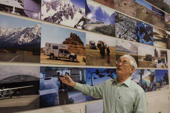 Dick Smith with some of the photographs of his adventures on the wall of his home office in Terrey Hills.