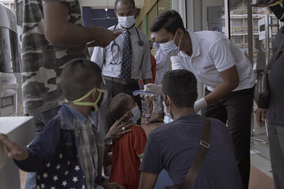 Rohingya refugees are screened for coronavirus at a local clinic facility in Kuala Lumpur, Malaysia.