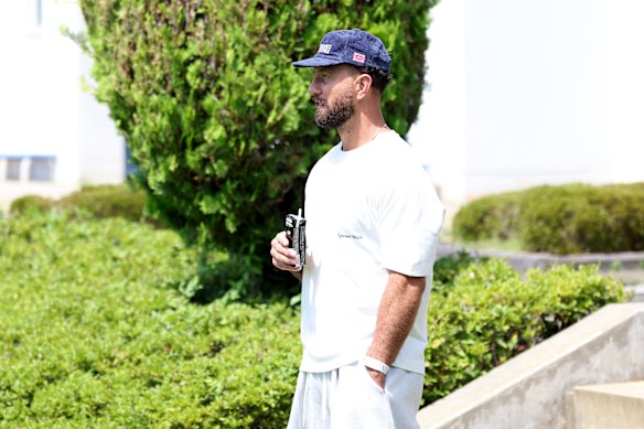 Former Wallabies player Quade Cooper, who coaches in Osaka, looks on during the Wallabies training session.