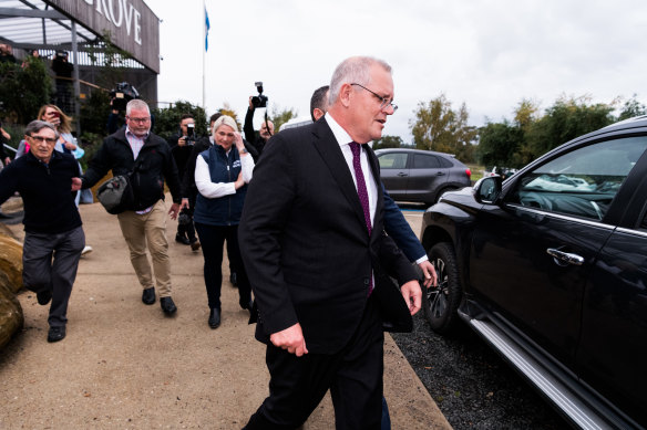 Trevor Sofield (left), former high commissioner to the Solomon Islands, tried to talk to the prime minister at a cafe but was pushed aside by security.