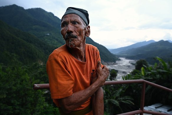 Jhalak Bahadur Shrestha looks over the Trishuli River and what remains of Betrawoti.