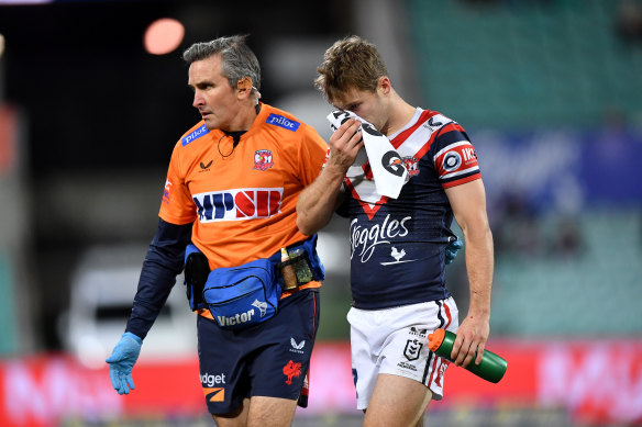 Sam Walker leaves the field after the Felise Kaufusi contact.