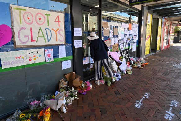 Flowers and signs for Gladys Berejiklian after she resigned ahead of an ICAC public inquiry. 