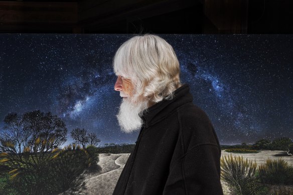 Artist Michael Glasheen with one of his works, Emu In The Milky Way.