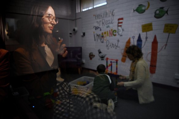 Dr Georgie Fleming watches a parent and child interact in a purpose-built clinic at Ingleburn Primary School as part of an enhanced therapy for children with callous unemotional traits.