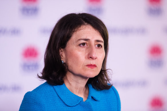 A government worker who shared an image of former NSW premier Gladys Berejiklian with a Hitler moustache has been compensated for being harshly dismissed.