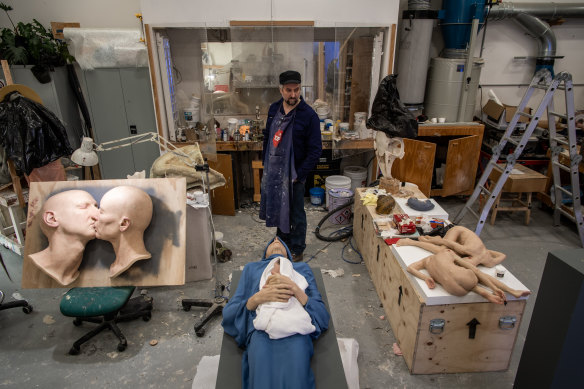 Sam Jinks in his studio with works in progress from his upcoming exhibition.