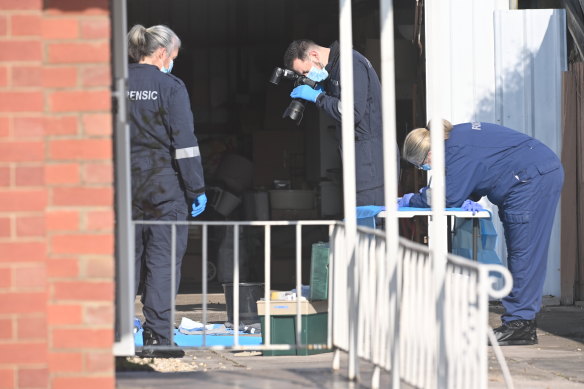 Forensic officers on Saturday with possible evidence at a Coolaroo home linked to the discovery of a woman’s body at a tip.