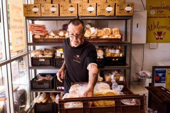 Ron Fletcher stocks the shelves before the morning rush. On a regular day the Community Cafe will receive about 75kg of leftover bread.