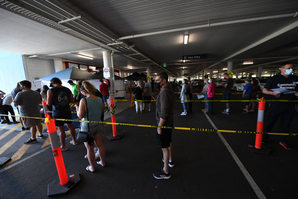 People line up to receive a COVID-19 jab at a Bunnings store in Brisbane.