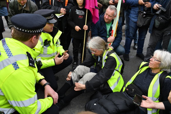 Police officers talk to protesters on Waterloo Bridge in April.