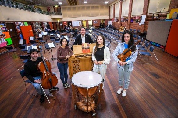 Royal Melbourne Philharmonic’s Andrew Wailes with new young members Lachlan Dent, Chizuru Maruyama, Leah Columbine and Sandra Ionescu. The Philharmonic holds the world record for consecutive Messiah performances.