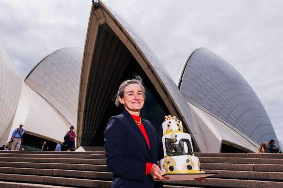 Opera House CEO Louise Herron holds a cake made by our own  deputy production editor Michael Gadd to celebrate the landmark’s 50th birthday.