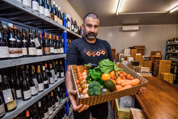 Jagdev Singh from the Local Drop in East Brunswick with one of the produce boxes he will deliver to people in need.
