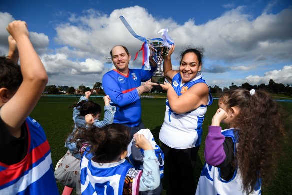 Go team: Michael Harrison from the WynBay Bulldogs and Netty Kuila from the cohealth Kangaroos and young fans at Whitten Oval where the community cup will be played.