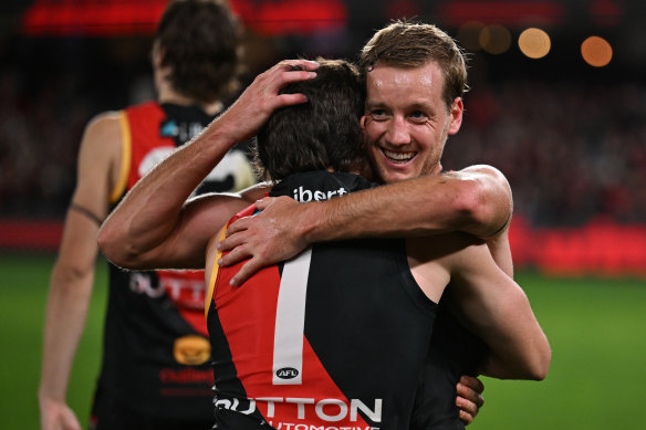 Darcy Parish and Andrew McGrath (No.1) celebrate the Bombers’ triumph over the Giants.