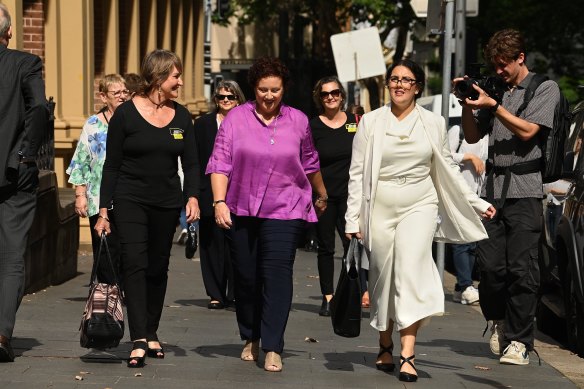 Kathleen Folbigg, centre, Tracy Chapman, left, and her lawyer Rhanee Rego outside the NSW Supreme Court in Sydney.