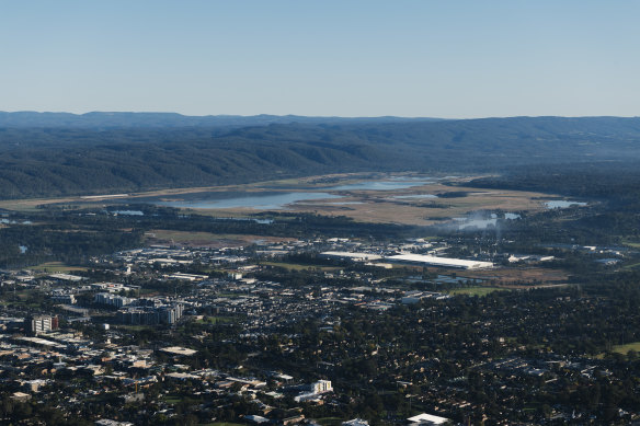 An aerial photograph of Greater Western Sydney taking in Penrith, Cranebrook and the Nepean River  with the Blue Mountains rising in the background.