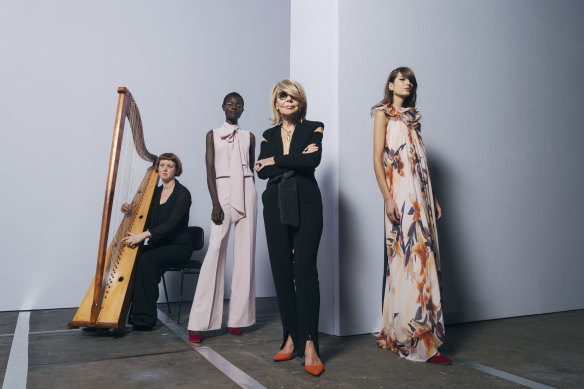 Carla Zampatti, with models Amer Athiu, Roberta Pecoraro and harpist Hannah Lane from the Australian Brandenburg Orchestra, which performed during Carla’s show at Mercedes-Benz Fashion Week Australia, Carriageworks, Everleigh. May 2019. 