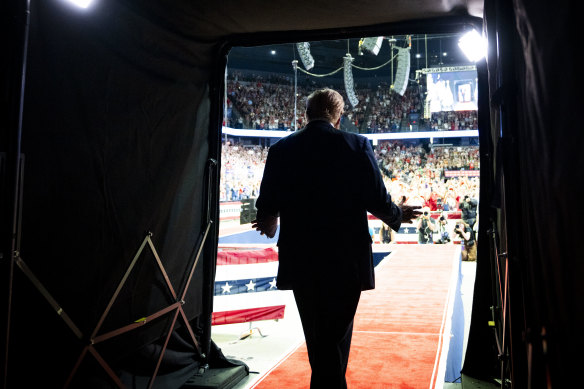 Former president Donald Trump takes the stage for a campaign rally in Grand Rapids, Michigan on Saturday.