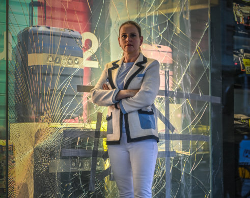 Anja Faustein in front of a smashed window on Elizabeth Street.
